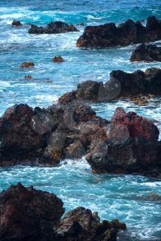 Easter Island rocky coast. The waves of the Pacific Ocean