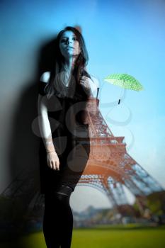 umbrella flying through the air against the backdrop of the Eiffel Tower. Summer trip to France in Paris. Photo with double exposure