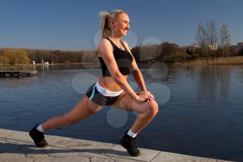 Girl doing exercises on the River
