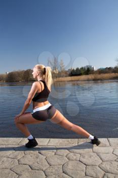 Girl doing exercises on the River