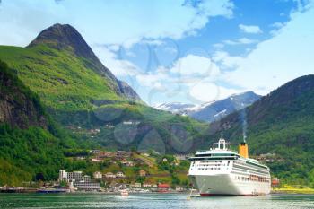Ferry in Geiranger. bay in the Norwegian mountains