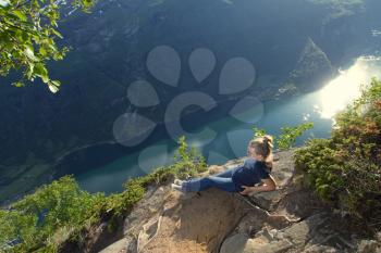 girl in the mountains overlooking the fjord