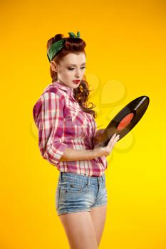 pin-up girl. beautiful young woman isolated on white in studio in old fashion clothes representing pinup and retro style