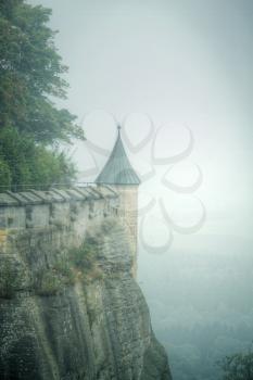 fortress Königstein. autumn fog and the mountain with the castle.