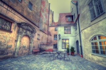 Vintage retro travel image of a narrow medieval street in old town Riga