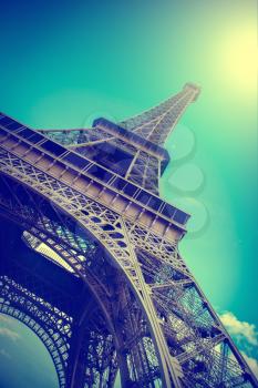 Eiffel Tower reflected in water. Summer in Paris. Travel background with retro vintage instagram filter