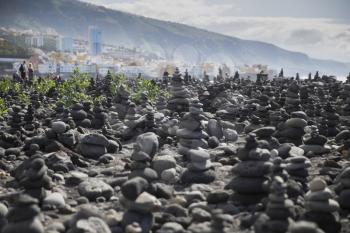 Art of stone balance, piles of stones on the beach. Tenerife, Canary Islands. Spain

