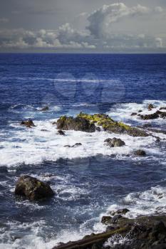 Rocks in sea near Puerto de la Cruz town on coast of Tenerife island, Spain