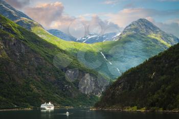 Waterfall in Geiranger fjord Norway - nature and travel background