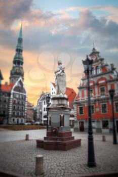 City Hall Square with House of the Blackheads and Saint Peter church in Old Town of Riga in the evening, Latvia