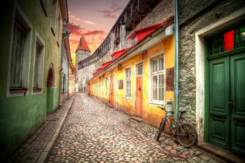 bike on the street. Old streets of European cities. Cozy cottages. Tallinn the capital of Estonia on the Baltic Sea.