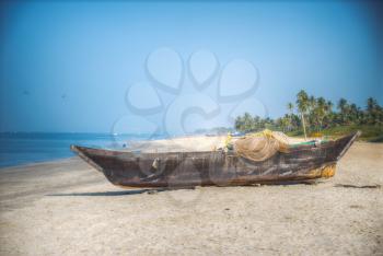 Goa is a state in the south-west of India. The boat is by the ocean
