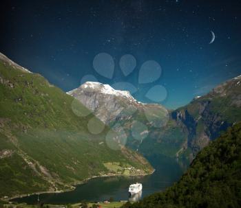 scenic landscapes of the northern Norwegian fjords. night shining moon and stars. 