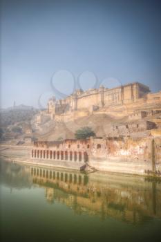Amber Fort or Amer - fortified residence of Raja in the eponymous northern suburbs of Jaipur, on the crest of a rocky hill behind the lake Maota