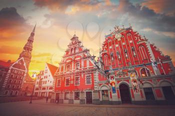 City Hall Square with House of the Blackheads and Saint Peter church in Old Town of Riga in the evening, Latvia