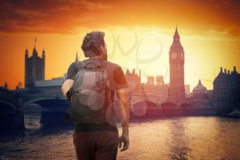 A traveler with a backpack. Big Ben at sunset.  London, England