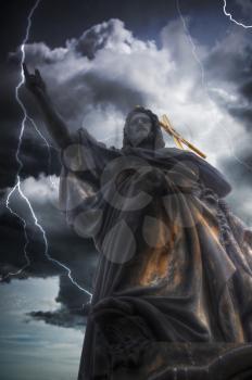 Heavy thunderstorm with lightning. statue of Jesus Christ. Prague - Charles bridge, Czech Republic. 