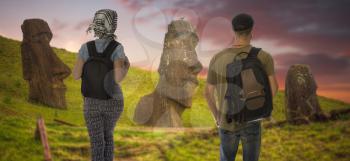 a young couple of tourists traveling along Easter Island.