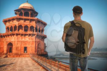 a male tourist is traveling around the city of Agra. Taj Mahal.