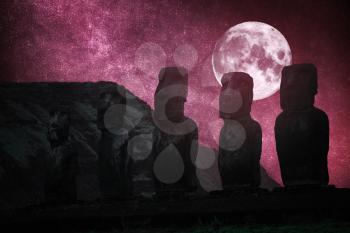 Moais at Ahu Tongariki (Easter island, Chile). night, the starry sky and the moon shine.