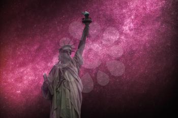 Astrophotography, starry sky shines at night. Statue of Liberty Neoclassical sculpture on Liberty Island southwest of Manhattan Island, USA