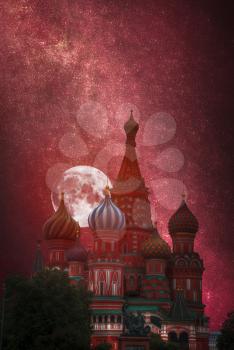St. Basil's Cathedral - an Orthodox church on Red Square in Moscow. At night the moon and stars shine.
