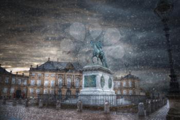 snow goes in winter. The Royal Amalienborg Palace in Copenhagen. Denmark