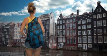 woman tourist travel around the city of Amsterdam.