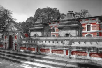  Votive temples and shrines in a row at Pashupatinath Temple, Kathmandu, Nepal. black and red and white photo