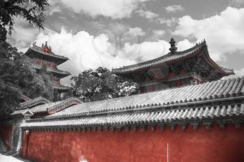 Shaolin is a Buddhist monastery in central China. black and red and white photo