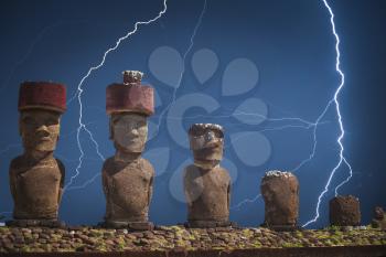 Strong thunder and powerful flashes of lightning. A statue on Easter Island or Rapa Nui in the southeastern Pacific, the territory of Chile.