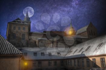 Akershus Fortress in Oslo. At night, under the light of the stars and the moon.