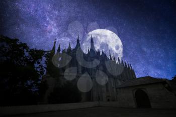 Kutna Hora in the Czech Republic. at night the stars and the moon shine.