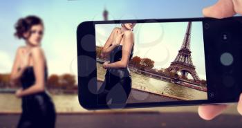 blogger shoots on a smartphone a girl in the style of pin up