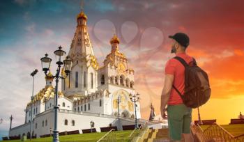 a male tourist is traveling around the city of Minsk. Belarus.