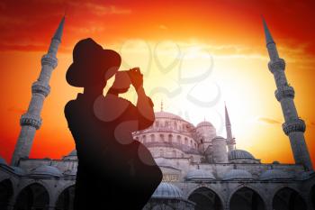 silhouette of a woman against a blue Mosque, Istanbul.