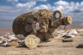 treasure from bitcoin on background of bottle with money on the beach