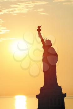 silhouette of the Statue of Liberty at sunset. NY. USA.
