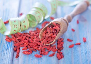 dry goji berries on the wooden table