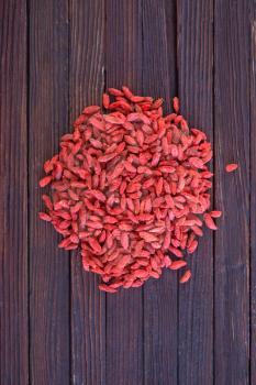 dry red berries, dry goji berries on a table