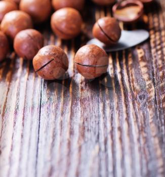 macadamia nuts on the wooden table, macadamia on a table