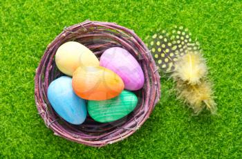 decorative painted Easter eggs on a table, easter background