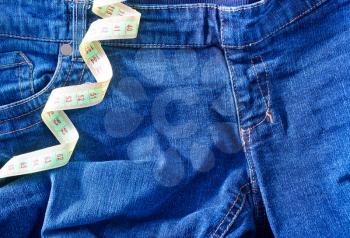 Jeans and green centimeter, jeans background, jeans texture