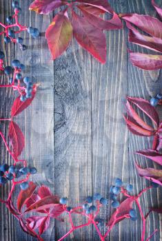 autumn leaves  on the wooden background, red leaves