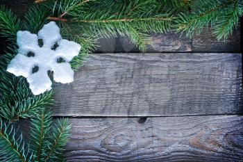 christmas background, snowflakes on the wooden background