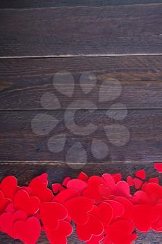 red hears on the wooden table, hearts on wood
