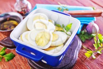boiled eggs in bowl and on a table