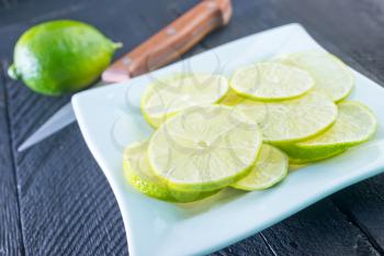 fresh lime on plate and on a table