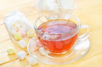 Fresh tea with candy