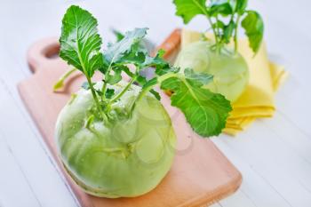 Cabbage kohlrabi on Wooden Kitchen Board